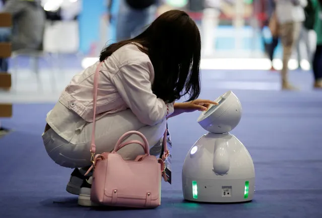 A staff member sets up a ROBOTLEO robot  at the Global Mobile Internet Conference (GMIC) 2017 in Beijing, China April 28, 2017. (Photo by Jason Lee/Reuters)