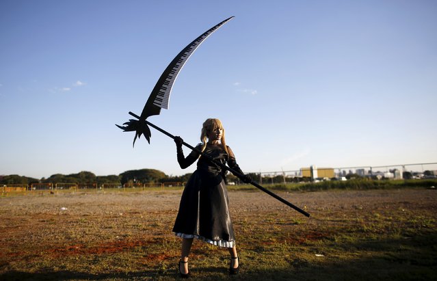 A cosplay enthusiast poses as Maka Albarn of the Soul Eater anime series during the “Anime Friends” annual event in Sao Paulo July 19, 2015. Anime Friends is one of Brazil's biggest events related to anime, manga and Japanese culture. (Photo by Nacho Doce/Reuters)