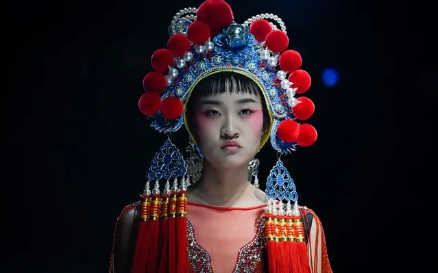 A model displays a creation from the “David Sylvia” collection by Weimin Hao during China Fashion Week in Beijing on October 28, 2019. (Photo by Wang Zhao/AFP Photo)