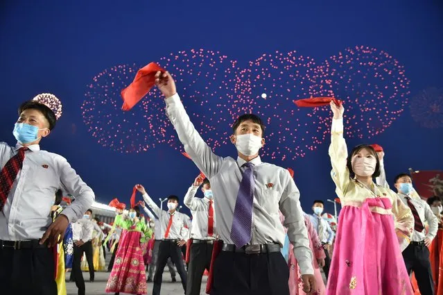 Students and youth attend a dancing party in celebration of the 110th birth anniversary of President Kim Il Sung, known as 'Day of the Sun', at Kim Il Sung Square in Pyongyang on April 15, 2022. North Korea marked the birthday of its founding leader on April 15, with a rare “live” broadcast of celebrations in Pyongyang, but no sign of the military parade or weapons tests that many analysts had predicted. (Photo by Kim Won Jin/AFP Photo)