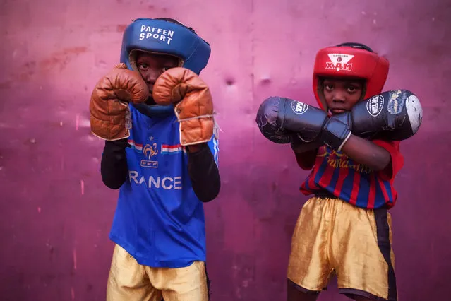 David Samba (l) and Onomo Mugabi train at the “Muhammad Ali's head high” (“La Tete Haute de Mohamed Ali”) Boxing Club in Kinshasa on June 4, 2016. The club is located at the Tata Raphael Stadium of Kinshasa, the place where the historic boxing event “Rumble in the Jungle” took place between Muhammad Ali and George Foreman the 30th of October of 1974. (Photo by Eduardo Soteras/AFP Photo)