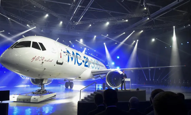 Russian Prime Minister Dmitry Medvedev speaks at the unveiling ceremony of a new passenger jet MC-21-300 at a plane at “Irkut” corporation assembling plant in Irkutsk, Russia, Wednesday, June 8, 2016. Russia unveiled new MC-21-300 airliner ahead of flight tests for the new passenger jet. (Photo by Alexander Astafyev/Sputnik, Government Press Service Pool Photo via AP Photo)