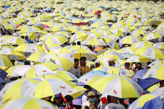 People wait for Pope Francis at the Esplanade of Taci Tolu during his apostolic trip to Asia, in Dili, East Timo on September 10, 2024. (Photo by Guglielmo Mangiapane/Reuters)