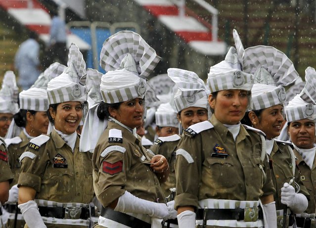 Indian policewomen take part in a parade as it rains during India's Independence Day celebrations in Srinagar, August 15, 2015. (Photo by Danish Ismail/Reuters)