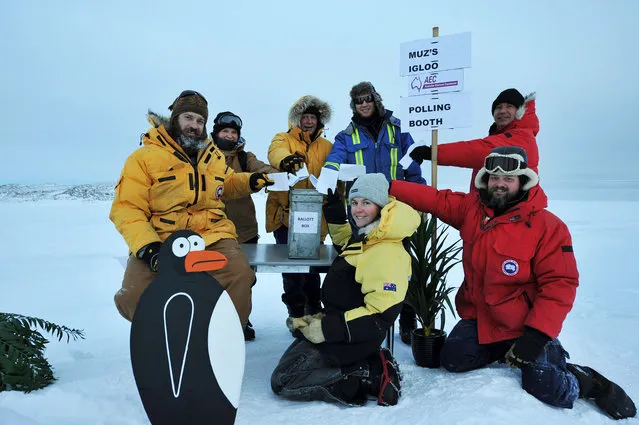 Voters stationed at the Casey Research Station in Antarctica pose with their ballots for the Australian federal election in this handout picture taken by Michael Brill of the Australian Antarctic Division, June 28, 2016. (Photo by Michael Brill/Reuters/Australian Antarctic Division)