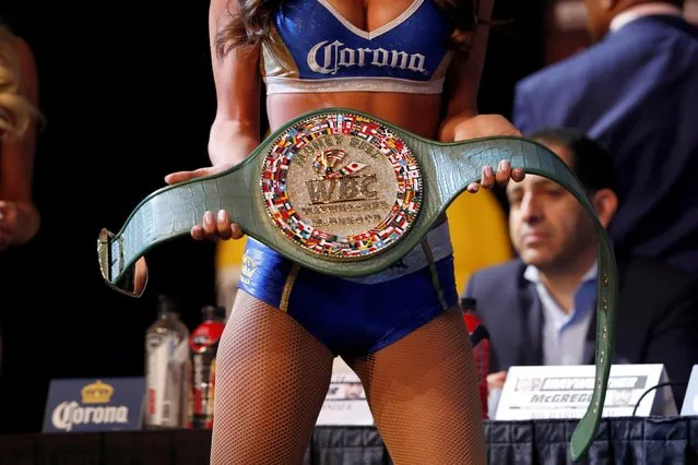 The victor' s belt is displayed during a press conference with boxer Floyd Mayweather Jr. and MMA figher Connor Mcgregor on August 23, 2017 at the MGM Grand in Las Vegas, Nevada. .Mayweather, the 40- year- old undefeated former welterweight boxing champion, has been lured out of retirement to face McGregor, a star of mixed martial arts' Ultimate Fighting Championship. The two men meet in a 12- round contest under boxing rules on August 26 th that is tipped to become the richest fight in history. (Photo by Steve Marcus/Reuters/Las Vegas Sun)