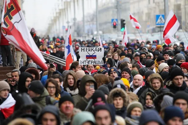 People participate in protests against the integration of Belarus with Russia in Minsk on December 7, 2019. (Photo by Radio Free Europe/Radio Liberty)