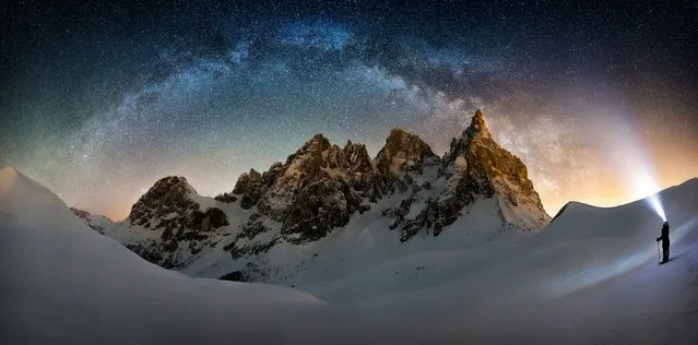 “Frozen Giant Nicholas Roemmelt”. The celestial curve of the Milky Way joins with the light of a stargazer’s headlamp to form a monumental arch over the Cimon della Pella in the heart of the Dolomites mountain range in northeastern Italy. (Photo by Nicholas Roemmelt/Royal Observatory Greenwich’s Astronomy Photographer of the Year 2016/National Maritime Museum)