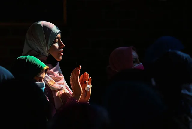 Muslim women attend Eid al-Fitr prayers, marking the end of the holy fasting month of Ramadan, in Milan, Italy, May 2, 2022. (Photo by Flavio Lo Scalzo/Reuters)