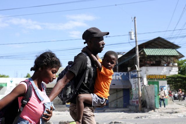 Residents of Delmas 30 neighbourhood flee their homes due to gang violence, in Port-au-Prince, Haiti on February 25, 2025. (Photo by Jean Feguens Regala/Reuters)