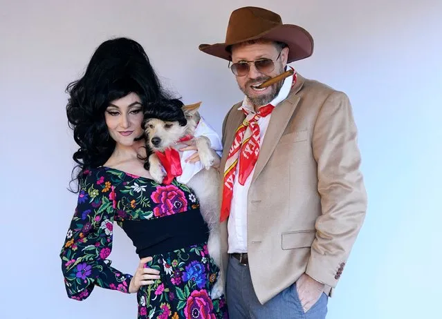 Dogs and owners compete in the 32nd Tompkins Square Halloween Dog Parade on October 22, 2022, at Tompkins Square in New York City. (Photo by Timothy A. Clary/AFP Photo)