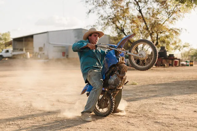 17-year-old station ringer Kody Taylor puts the station manager's son's bike through its paces in far north Queensland, Australia. Kody hoped to be a champion bull rider and boxer until an injury cut his sporting career short. (Photo by Benjamin Rutherford)