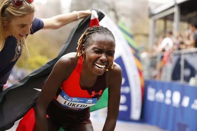 Sharon Lokedi, of Kenya, reacts after crossing the finish line first in the women's division of the New York City Marathon, Sunday, November 6, 2022, in New York. (Photo by Jason DeCrow/AP Photo)