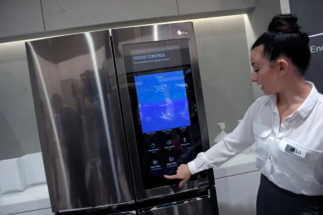 An assistant presents a smart home refridgerator by LG at the IFA Electronics show in Berlin, Germany September 2, 2016. (Photo by Stefanie Loos/Reuters)