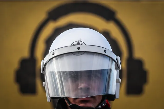 Turkish riot police officer guards during a demonstration marking the International Day for the Elimination of Violence Against Women in Istanbul, Turkey, 27 November 2022. The International Day for the Elimination of Violence Against Women, celebrated on 25 November annualy, was established in an effort to raise awareness of the fact that women around the world are subject to rape, domestic violence and other forms of violence. (Photo by Sedat Suna/EPA/EFE)
