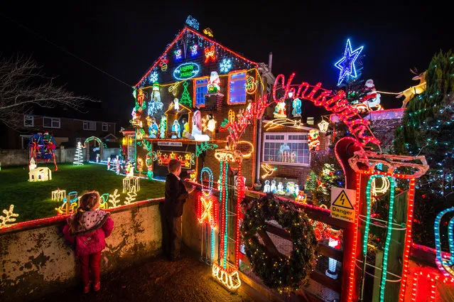 Festive lights and decorations adorn a house in Brentry, Bristol, England. (Photo by Ben Birchall/PA Wire)