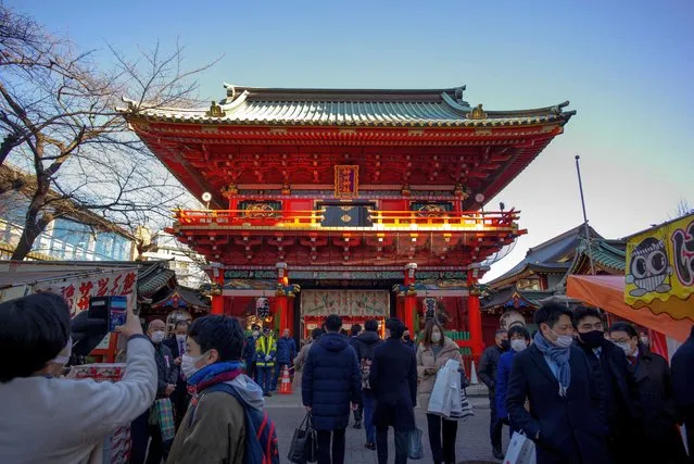 People visit Kanda Myojin Shrine to offer New Year prayers in Tokyo on January 4, 2023. (Photo by Kazuhiro Nogi/AFP Photo)