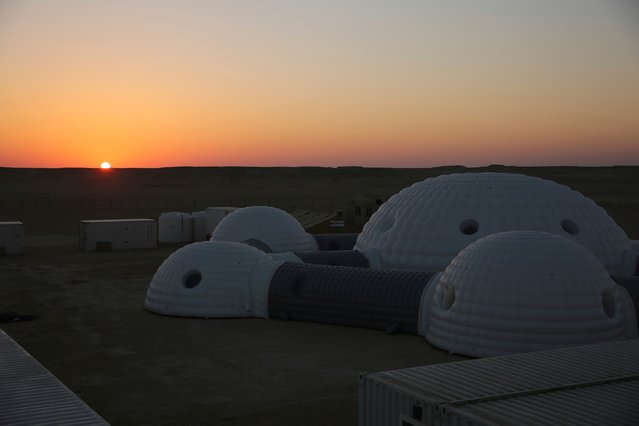 The sun rises over a 2.4-ton inflated habitat used by the AMADEE-18 Mars simulation in the Dhofar desert of southern Oman on Thursday, February 8, 2018. (Photo by Sam McNeil/AP Photo)