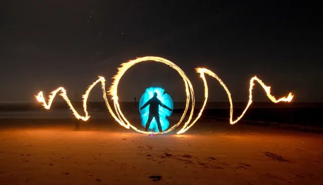 Painting with light on Frinton beach, Frinton-on-Sea in Essex on Wednesday evening, January 4, 2023 using fire and a light stick during a 15 second exposure. (Photo by Kevin Jay/Picture Exclusive)