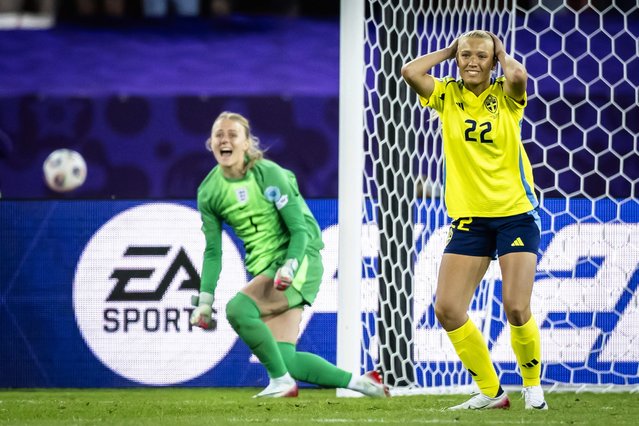 Sweden's Smilla Holmberg (22) reacts after missing as England's Hannah Hampton celebrates during a penalty shootout at the Women's Euro 2025 quarterfinals soccer match between Sweden and England at Stadion Letzigrund in Zurich, Switzerland, Thursday, July 17, 2025. (Photo by Michael Buholzer/Keystone via AP Photo)