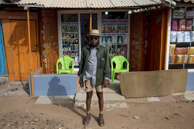 Fashion stylist Daniel Quist poses for a picture in front of a beauty parlour in Accra, Ghana, June 12, 2015. (Photo by Francis Kokoroko/Reuters)