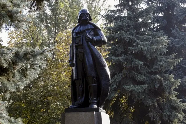 A monument to the character of Darth Vader from "Star Wars", which was rebuilt from a statue of Soviet state founder Vladimir Lenin, is seen in Odessa, Ukraine, October 23, 2015. The Internet Party of Ukraine's main candidate, a person named for the legendary "Star Wars" villain Darth Vader, campaigned in Odessa, cruising through town on a black van to the sound of Imperial March from "Star Wars" saga. (Photo by Yevgeny Volokin/Reuters)