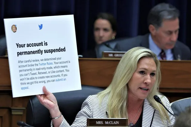 U.S. Rep. Marjorie Taylor-Greene (R-GA) holds up a poster of a Twitter announcement of suspending her account during a hearing before the House Oversight and Accountability Committee at Rayburn House Office Building on Capitol Hill on February 8, 2023 in Washington, DC. The committee held a hearing on “Protecting Speech from Government Interference and Social Media Bias, Part 1: Twitter's Role in Suppressing the Biden Laptop Story”. (Photo by Alex Wong/Getty Images)