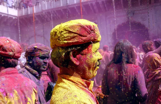Indian people participate in the Holi festival in Vrindavan, Uttar Pradesh, India, 27 February 2018. Holi, the Hindu spring festival of colors, will be celebrated across the country on 02 March. (Photo by Harish Tyagi/EPA/EFE)