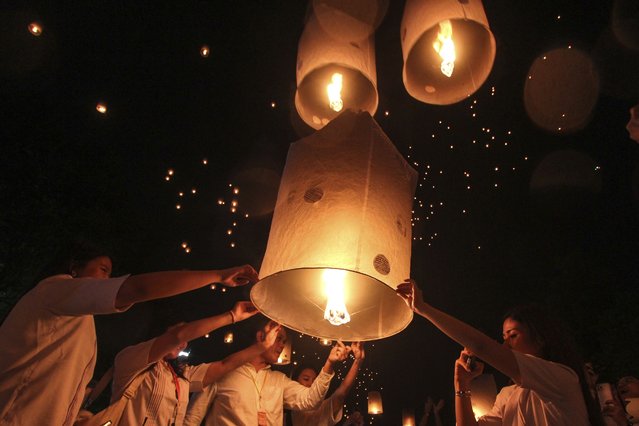 People release lanterns during the celebration of Vesak, which marks the day of Buddha's birth, death and enlightenment at the 9th century Borobudur Temple in Magelang, Central Java, Indonesia, Thursday, May 23, 2024. (Photo by Slamet Riyadi/AP Photo)