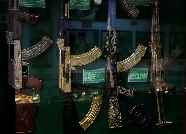 Guns decorated with gold are displayed in the Drugs Museum, used by the military to showcase to soldiers the lifestyles of Mexican drug lords, at the headquarters of the Ministry of Defense in Mexico City, October 14, 2016. (Photo by Henry Romero/Reuters)