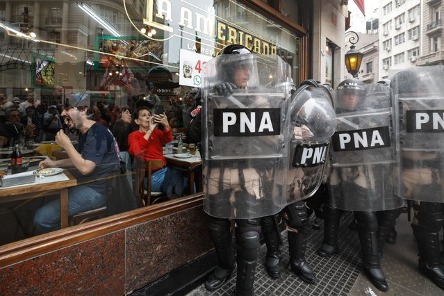 Police clash with demonstrators that gathered outside the senate during a debate in Buenos Aires, Argentina, 12 June 2024. The Argentina senate begins the debate of the Law Bases and Starting Points for the Freedom of Argentines, key piece for the reforms of the President Javier Milei, as a fiscal package, after obtaining the approval of the deputy chamber on 29 April. (Photo by Juan Ignacio Roncoroni/EPA/EFE/Rex Features/Shutterstock)