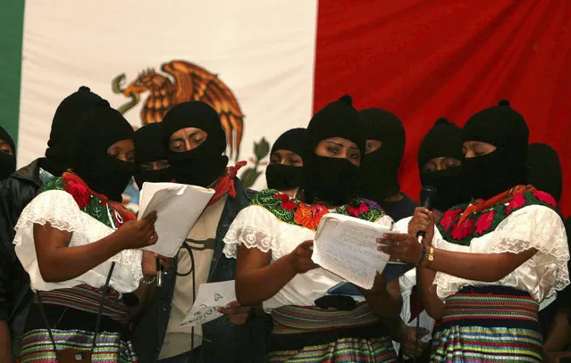 In this July 24, 2007 file photo, masked female members of the Zapatista National Liberation Army (EZLN), sing during a meeting with supporters in Morelia, Chiapas state, Mexico, after the rebels pledged to move away from armed struggle and toward politics more than a decade after a short-lived revolt for Indian rights and socialism. The EZLN announced on Friday, Oct. 14, 2016 its decision to nominate an indigenous woman as their independent candidate for Mexico's presidency, ahead of 2018 elections. (Photo by Moyses Zuniga/AP Photo)