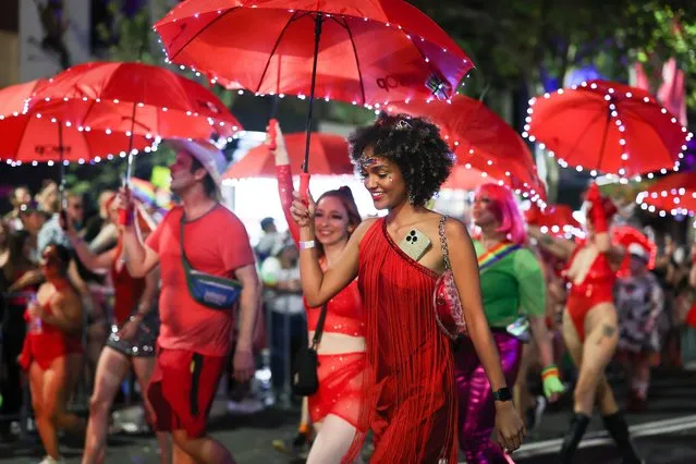 Participants take part in the 45th annual Gay and Lesbian Mardi Gras parade on Oxford Street in Sydney, New South Wales, Australia, 25 February 2023. The event, with the participation of 12,500 marchers and over 200 floats adorning Oxford Street for the first time since 2020, promotes LGBTQIA+ rights, acceptance and inclusion. (Photo by Paul Braven/EPA/EFE)
