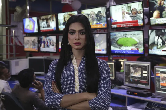 In this photo taken on Tuesday, March 27, 2018, Pakistan's first transgender newscaster Marvia Malik poses for a photo in a control room of a local television channel in Lahore, Pakistan. Malik has made history in Pakistan by becoming the first transgender newscaster in a conservative Muslim country where her community is taunted in public, ostracized by family and targeted in violent attacks. (Photo by K.M. Chaudary/AP Photo)