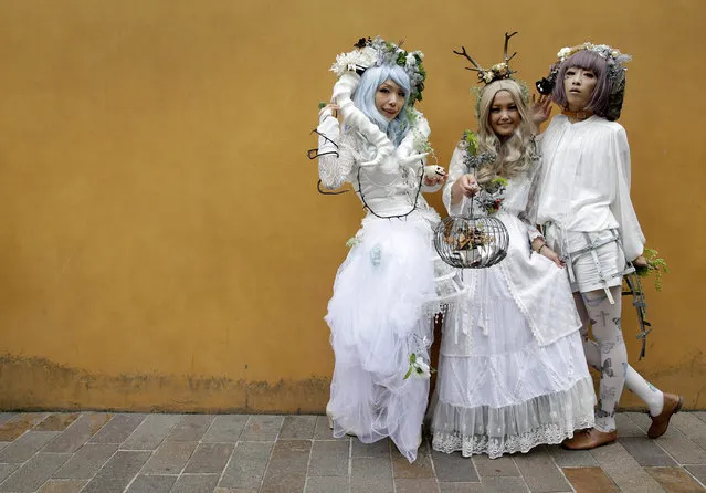 Participants in costume pose for photographers before a Halloween parade in Kawasaki, south of Tokyo, Japan, 30 October 2016. (Photo by Yuya Shino/EPA)