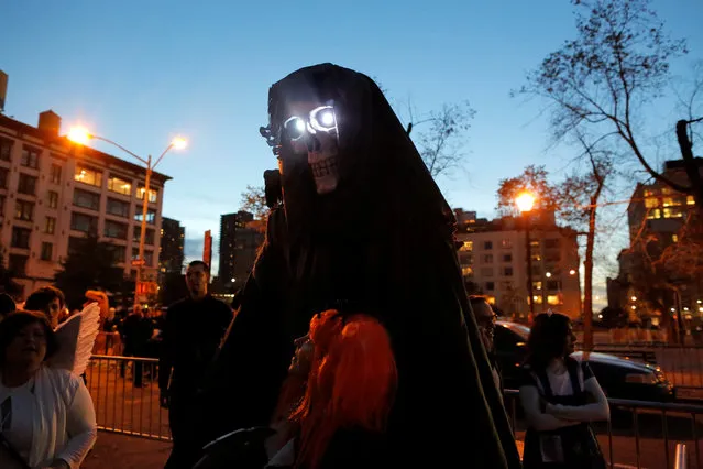 Participants in costume gather before participating in the Greenwich Village Halloween Parade in Manhattan, New York, U.S., October 31, 2016. (Photo by Andrew Kelly/Reuters)