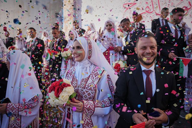 Palestinian couples participate in a mass wedding ceremony in Hamad City in Khan Younis, Gaza Strip, Tuesday, December 2, 2025. (Photo by Abdel Kareem Hana/AP Photo)