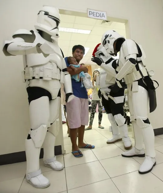 Cosplayers dressed as characters from the Star Wars movie series visit patients during a charity event organised by non-profit group 501st Legion, at East Avenue Medical Center in Quezon city, metro Manila  December 6, 2015. (Photo by Romeo Ranoco/Reuters)