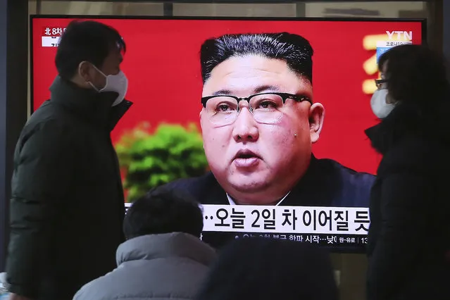 People walk by a TV screen showing North Korean leader Kim Jong Un during a ruling party congress, at the Seoul Railway Station in Seoul, South Korea, Wednesday, January 6, 2021. Kim opened his country's first ruling party congress in five years with an admission of policy failures and a vow to set new developmental goals, state media reported Wednesday. (Photo by Ahn Young-joon/AP Photo)