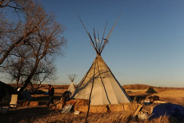 A tipi is seen in an encampment during a protest against the Dakota Access pipeline near the Standing Rock Indian Reservation near Cannon Ball, North Dakota November 7, 2016. Native American protesters occupied privately owned land in North Dakota in the path of the proposed Dakota Access Pipeline, claiming they were the land's rightful owners under an 1851 treaty with the U.S. government. The move is significant because the company building the 1,100-mile (1,886-km) oil pipeline, Dallas-based Energy Transfer Partners LP, has bought tracts of land and relied on eminent domain to clear a route for the line across four states from North Dakota to Illinois. In September, the U.S. government halted construction on part of the line. The Standing Rock Sioux and environmental activists have said further construction would damage historical tribal sacred sites and spills would foul drinking water. Since then, opponents have pressured the government to reroute construction. (Photo by Stephanie Keith/Reuters)