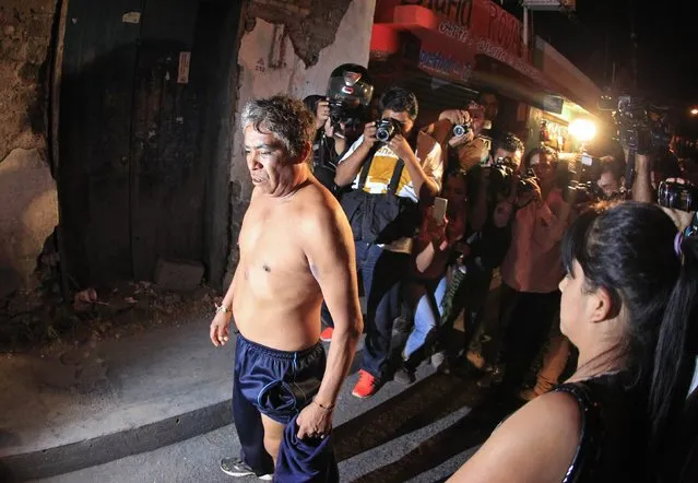A person (C) believed by the State Coordinator of Teachers of Guerrero (CETEG) to be a government infiltrator, shows his injuries to the media after being exchanged for two CETEG members detained earlier in a protest against the upcoming July legislative elections and in support of the missing 43 students from Ayotzinapa teachers' training college in Chilpancingo, Guerrero January 16, 2015. (Photo by Jorge Dan Lopez/Reuters)