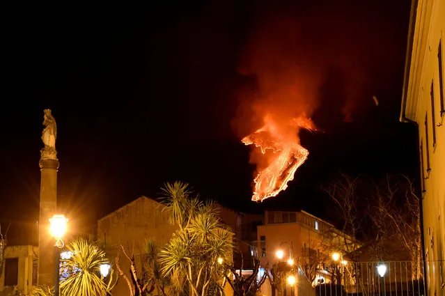 A lava stream runs down the slopes as Mount Etna volcano erupts, as seen from Milo, near Catania, Sicily, Italy, 21 February 2021. (Photo by Orietta Scardino/EPA/EFE)