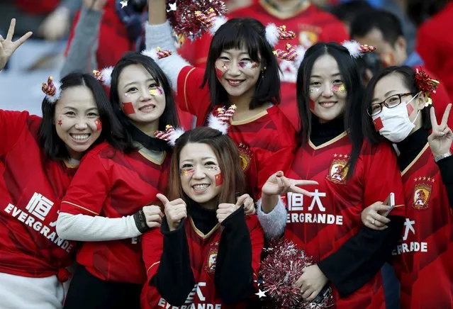 Supporters of China's Guangzhou Evergrande pose for a photograph as they cheer for the team before their Club World Cup third-place soccer match agsinst Japan's Sanfrecce Hiroshima in Yokohama, south of Tokyo, Japan, December 20, 2015. (Photo by Toru Hanai/Reuters)