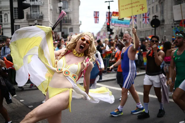 Members of the Lesbian, Gay, Bisexual and Transgender (LGBT+) community take part in the annual Pride Parade in the streets of London on July 1, 2023. (Photo by Henry Nicholls/AFP Photo)