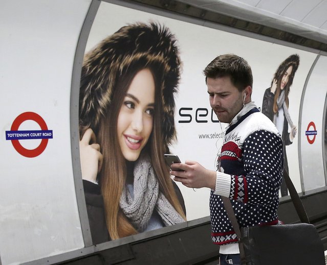 A passenger travels on the London underground system during the Christmas party season, December 17, 2015. (Photo by Paul Hackett/Reuters)