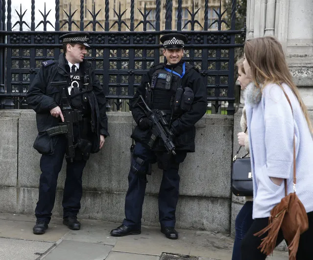 Armed police stand on duty outside The Houses of Parliament in London England, December 30, 2015. (Photo by Eddie Keogh/Reuters)