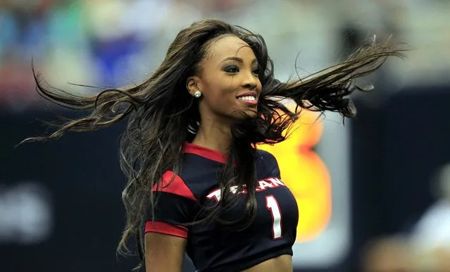 A Houston Texans cheerleader performs during a preseason game against the New Orleans Saints at Reliant Stadium. (Photo by Thomas Campbell/USA TODAY Sports)
