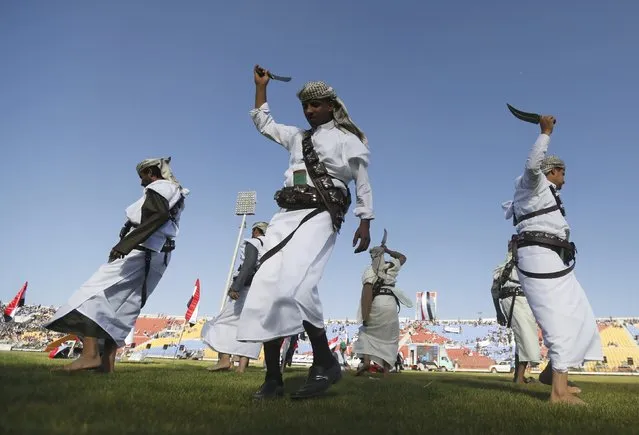 Followers of the Houthi group dance the during a rally at the main stadium in Sanaa, Yemen February 7, 2015. The leader of the group that has taken over Yemen, Abdel Malik al-Houthi, said on Saturday that he is open to participation with other parties. (Photo by Khaled Abdullah/Reuters)