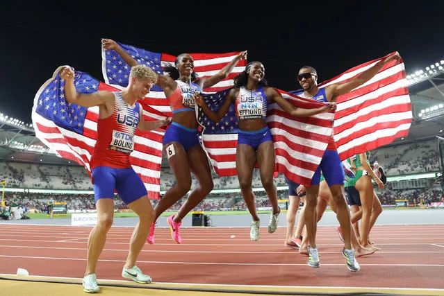 Matthew Boling, Alexis Holmes, Rosey Effiong, and Justin Robinson of  Team United States  pose for a photo after winning gold in the 4x400m Mixed Relay Final during day one of the World Athletics Championships Budapest 2023 at National Athletics Centre on August 19, 2023 in Budapest, Hungary. (Photo by Michael Steele/Getty Images)