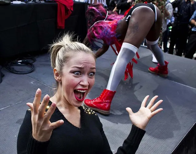 A woman reacts as people take part in “TWERKERS”, an event organized to break the Guinness World Record for largest number of people to perform a dance known as “twerking”, in New York, on September 25, 2013. (Photo by Eduardo Munoz/Reuters)